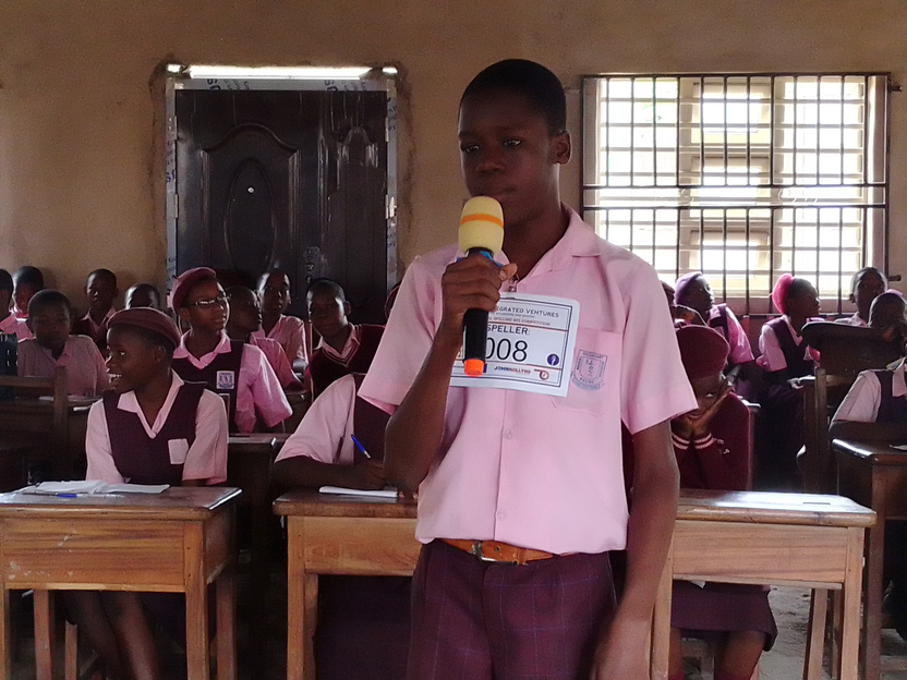 Student speaking into a microphone
