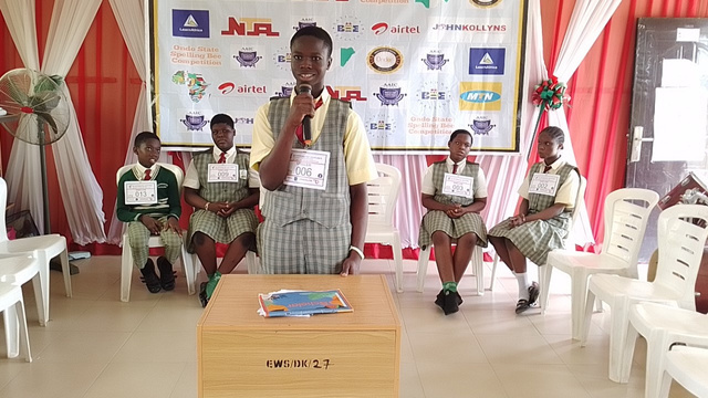 A student participating in a KCI spelling bee